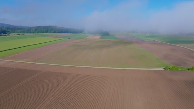 Aerial view of agricultural fields and morning mist Switzerland. Aerial view of agricultural fields and morning mist Switzerland.