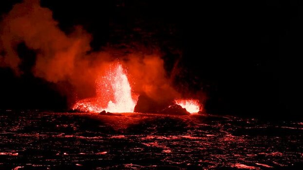 View of a fiery lava eruption at night United States.