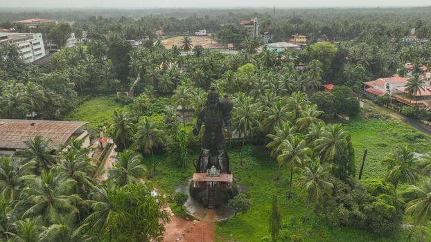 Aerial view of the large Shiva statue surrounded by lush palm trees and greenery in Udupi Karnataka India. Aerial view of the large Shiva statue surrounded by lush palm trees and greenery in Udupi Karnataka India.