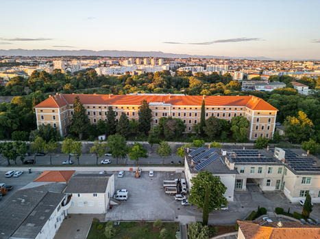 Zadar Croatia 17 May 2025 Aerial view of Vladimir Nazor Grammar School surrounded by lush trees and urban buildings in the historic city of Zadar.