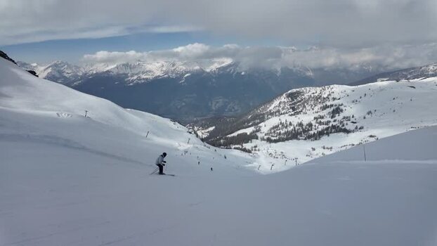 View of a skier on Sestriere s snowy slopes Italy. View of a skier on Sestriere s snowy slopes Italy.