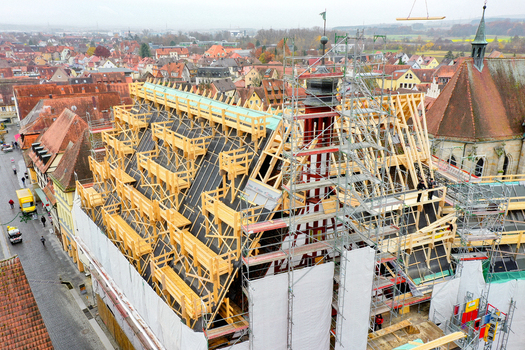 Aerial view of Rathaus Forchheim under renovation with scaffolding and wooden roof trusses overlooking the historic old town in Forchheim Bayern Germany. Aerial view of Rathaus Forchheim under renovation with scaffolding and wooden roof trusses overlooking the historic old town in Forchheim Bayern Germany.
