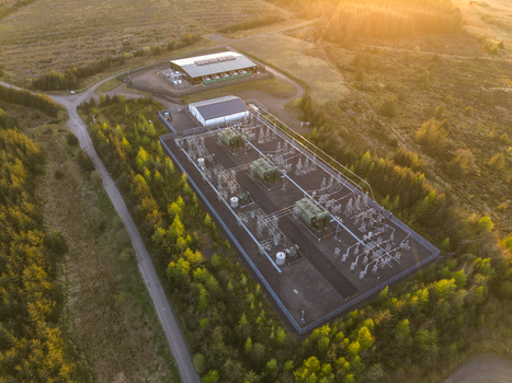 Aerial view of Eaglesham moor substation with electrical transformers and industrial buildings surrounded by dense forest at sunset Kilmarnock Scotland United Kingdom.