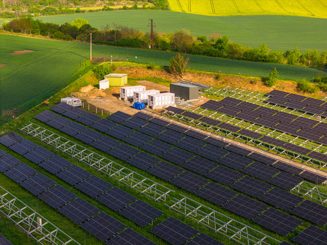 Aerial view of FVE Bohumilice solar power plant with rows of photovoltaic panels surrounded by lush green fields and yellow rapeseed Klobouky u Brna Jihomoravsky kraj Czechia. Aerial view of FVE Bohumilice solar power plant with rows of photovoltaic panels surrounded by lush green fields and yellow rapeseed Klobouky u Brna Jihomoravsky kraj Czechia.