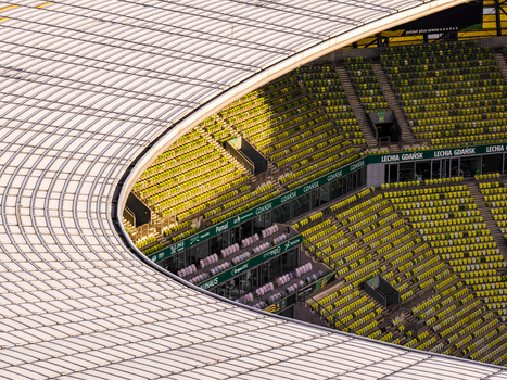Gdansk Wojewodztwo pomorskie Poland 27 March 2026 Aerial view of Polsat Plus Arena Gdansk showing the curved roof and rows of yellow stadium seating under bright sunlight. Gdansk Wojewodztwo pomorskie Poland 27 March 2026 Aerial view of Polsat Plus Arena Gdansk showing the curved roof and rows of yellow stadium seating under bright sunlight.