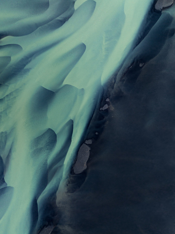 Aerial view of glacial rivers intertwine with dark sands creating a mesmerizing tapestry of contrasting blues and blacks Iceland Iceland. Aerial view of glacial rivers intertwine with dark sands creating a mesmerizing tapestry of contrasting blues and blacks Iceland Iceland.