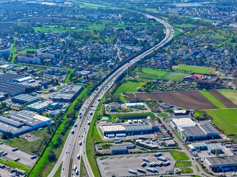 Aerial view of a major freeway cutting through urban and rural landscapes a dance of concrete and green Sausheim Grand Est France.