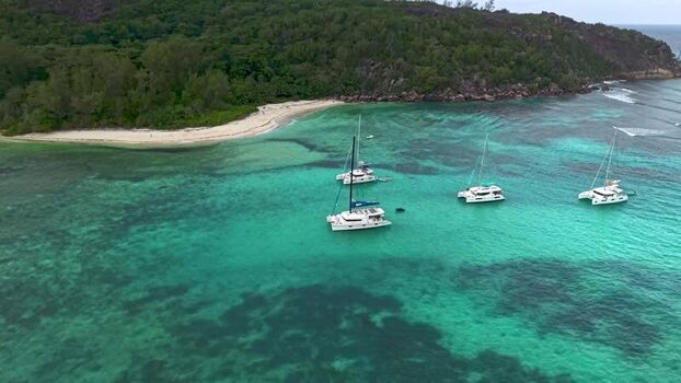 Aerial view of catamarans in turquoise waters Seychelles. Aerial view of catamarans in turquoise waters Seychelles.