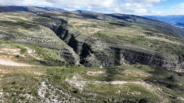 Aerial view of El Vergel canyon featuring deep rocky gorges and rugged terrain under a bright sky in Torotoro Potosi Department Bolivia. Aerial view of El Vergel canyon featuring deep rocky gorges and rugged terrain under a bright sky in Torotoro Potosi Department Bolivia.