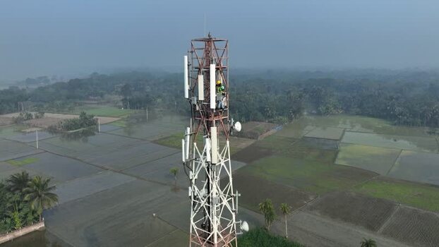 Aerial view of a telecom tower with a technician Bangladesh.