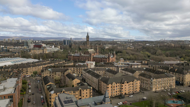 Scotland United Kingdom 01 April 2024 Aerial view of the University of Glasgow with gothic architecture surrounded by historic stone buildings urban blocks and green parkland. Scotland United Kingdom 01 April 2024 Aerial view of the University of Glasgow with gothic architecture surrounded by historic stone buildings urban blocks and green parkland.