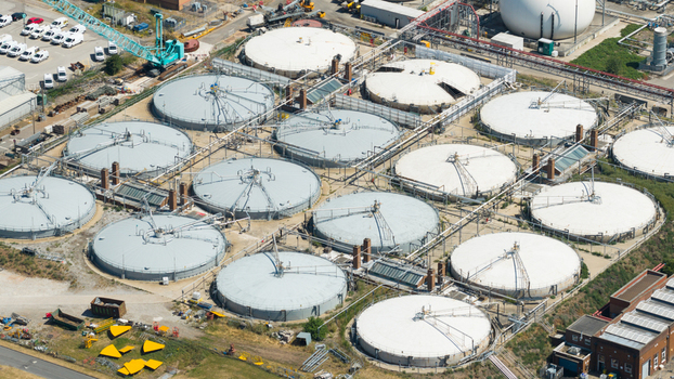 Aerial view of Severn Trent Water Minworth wastewater treatment plant featuring numerous circular sedimentation tanks and industrial infrastructure in Birmingham England United Kingdom. Aerial view of Severn Trent Water Minworth wastewater treatment plant featuring numerous circular sedimentation tanks and industrial infrastructure in Birmingham England United Kingdom.
