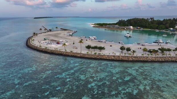 Aerial view of a tropical island harbor and turquoise waters Maldives. Aerial view of a tropical island harbor and turquoise waters Maldives.