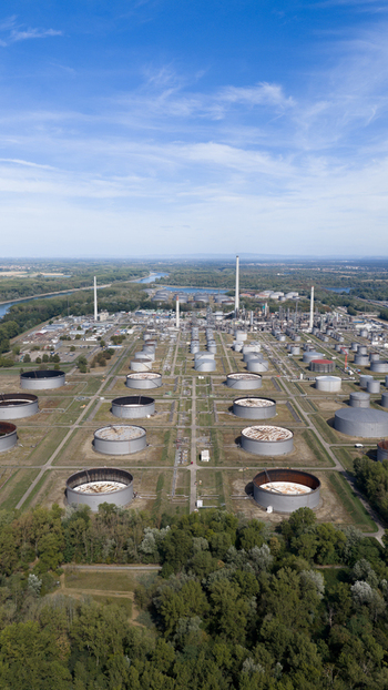 Aerial view of Mineralolraffinerie Oberrhein industrial facility with large storage tanks pipelines and processing towers near the Rhine river in Karlsruhe Baden Wurttemberg Germany. Aerial view of Mineralolraffinerie Oberrhein industrial facility with large storage tanks pipelines and processing towers near the Rhine river in Karlsruhe Baden Wurttemberg Germany.
