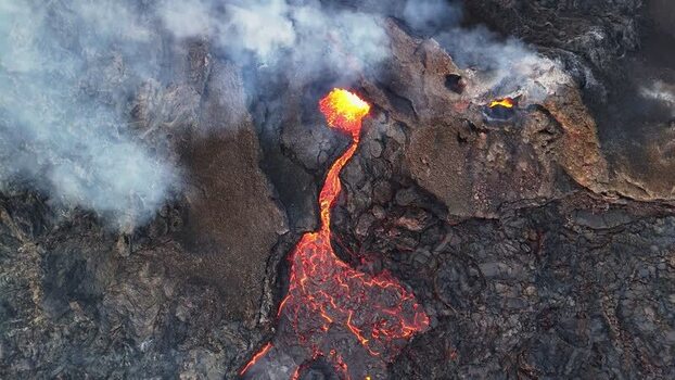Aerial view of Sundhnukur Volcano with glowing lava flow Iceland.