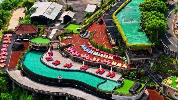 Aerial view of resort pool and lounge area in Bali Indonesia.