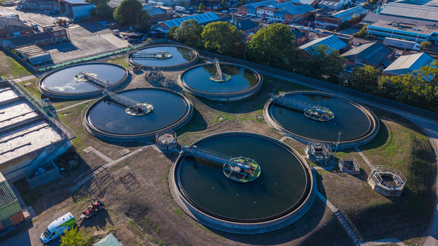 Aerial view of Water Treatment Centre Camberley featuring circular sedimentation tanks and industrial infrastructure in Camberley England United Kingdom. Aerial view of Water Treatment Centre Camberley featuring circular sedimentation tanks and industrial infrastructure in Camberley England United Kingdom.