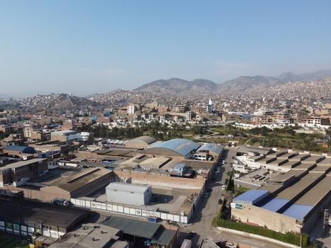 Aerial view of industrial warehouses and urban development in San Juan de Miraflores Lima Peru. Aerial view of industrial warehouses and urban development in San Juan de Miraflores Lima Peru.