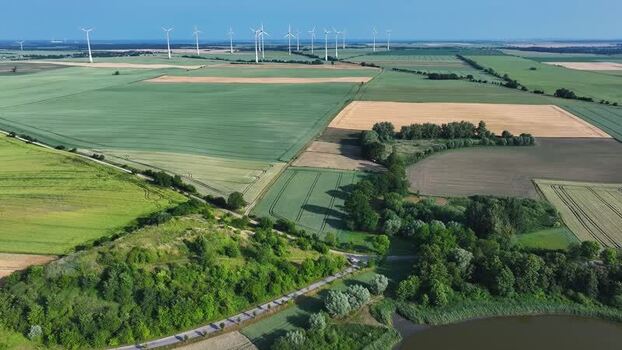 Aerial view of agricultural fields and wind turbines Germany.