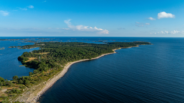 Aerial view of the lush green landscape and rocky coastline of Oro Fortress Island in the Baltic Sea Varsinais Suomi Finland. Aerial view of the lush green landscape and rocky coastline of Oro Fortress Island in the Baltic Sea Varsinais Suomi Finland.