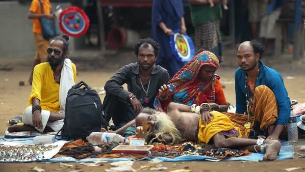 View of people sitting on the ground in Mahasthan Bangladesh.