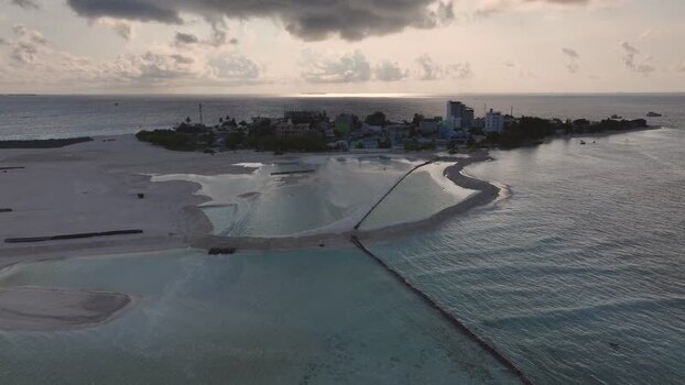 Aerial view of Gulhi island at sunset Maldives. Aerial view of Gulhi island at sunset Maldives.
