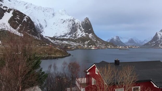 Aerial view of snowy Lofoten mountains and fjord Norway.