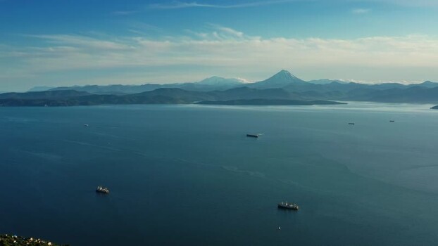 Aerial view of Avacha Bay with ships and volcanoes Russia.