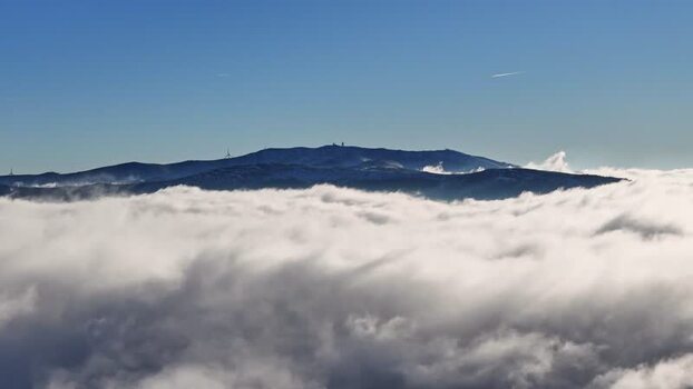 Aerial view of Windpark Freilanderalm 2 above clouds Austria.