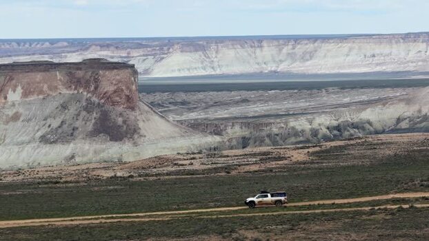 Aerial view of a vehicle driving through Bozjyra Kazakhstan.