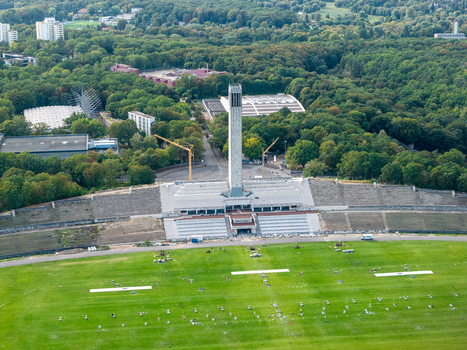 Berlin Germany 26 September 2026 Aerial view of the Olympiastadion Berlin bell tower and Maifeld during Pyronale preparations with equipment and technical setups arranged on the stadium field.