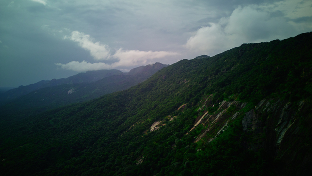Aerial view of lush green mountains meeting the stormy skies Anantagiri Andhra Pradesh India. Aerial view of lush green mountains meeting the stormy skies Anantagiri Andhra Pradesh India.