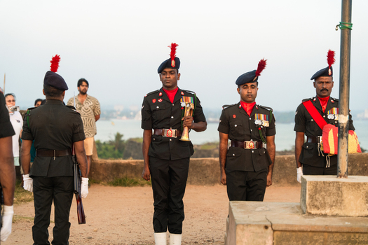 Galle Sri Lanka 24 January 2026 View of Sri Lankan soldiers in ceremonial uniforms standing at attention at Galle Fort with the ocean in the background.