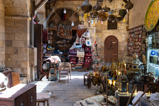 View of Khan el Khalili bazaar with traditional hanging lanterns colorful textiles and stone architecture El Gamaleya Cairo Governorate Egypt. View of Khan el Khalili bazaar with traditional hanging lanterns colorful textiles and stone architecture El Gamaleya Cairo Governorate Egypt.