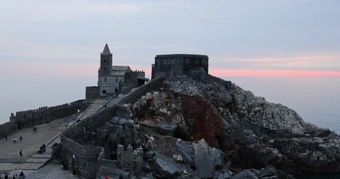 View of the Church of Saint Peter at dusk in Porto Venere Italy.
