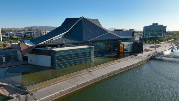 Aerial view of the Tempe Center for the Arts with its distinctive angular roof and glass facade situated along the waterfront of Tempe Town Lake in Tempe Arizona United States. Aerial view of the Tempe Center for the Arts with its distinctive angular roof and glass facade situated along the waterfront of Tempe Town Lake in Tempe Arizona United States.