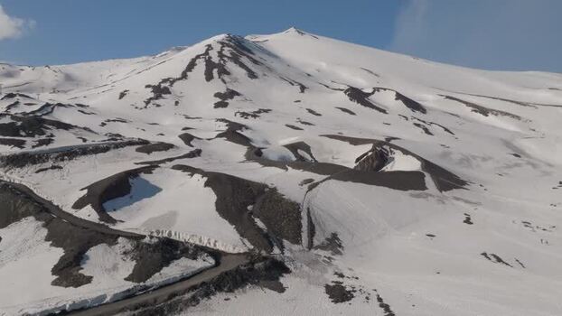 Aerial view of Rifugio Sapienza and snow covered craters on Mount Etna Italy. Aerial view of Rifugio Sapienza and snow covered craters on Mount Etna Italy.