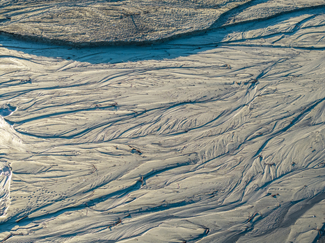 Aerial view of intricate sediment patterns and river channels on the exposed bed of Lake Czorsztynskie in Nowy Targ County Lesser Poland Voivode Poland. Aerial view of intricate sediment patterns and river channels on the exposed bed of Lake Czorsztynskie in Nowy Targ County Lesser Poland Voivode Poland.