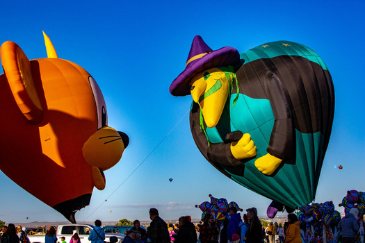 Albuquerque United States 12 October 2017 View of vibrant character themed hot air balloons rising high against a crisp clear blue sky a whimsical spectacle over the New Mexico landscape. Albuquerque United States 12 October 2017 View of vibrant character themed hot air balloons rising high against a crisp clear blue sky a whimsical spectacle over the New Mexico landscape.