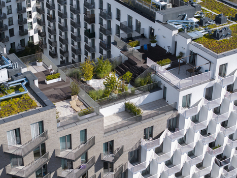 Aerial view of modern apartment building with green roof terraces and geometric facade patterns in Krakow Lesser Poland Voivode Poland.