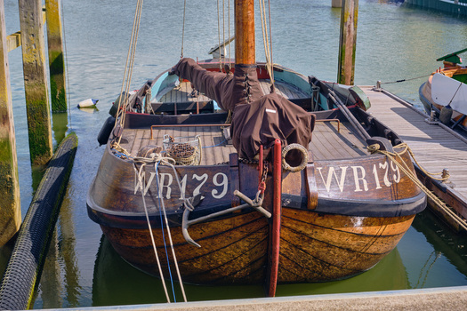 Den Oever Netherlands 18 May 2026 View of a historic Wieringeraak sailing vessel moored in the fishing harbor with its wooden hull and traditional rigging. Den Oever Netherlands 18 May 2026 View of a historic Wieringeraak sailing vessel moored in the fishing harbor with its wooden hull and traditional rigging.
