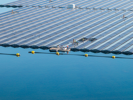 Aerial view of the floating solar farm at Cottbuser Ostsee with workers performing repair works on the solar panels in Cottbus Brandenburg Germany. Aerial view of the floating solar farm at Cottbuser Ostsee with workers performing repair works on the solar panels in Cottbus Brandenburg Germany.