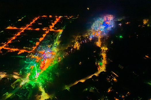 Aerial view of Annafest festival at night with vibrant colorful lights amusement park rides and illuminated streets Forchheim Bayern Germany. Aerial view of Annafest festival at night with vibrant colorful lights amusement park rides and illuminated streets Forchheim Bayern Germany.