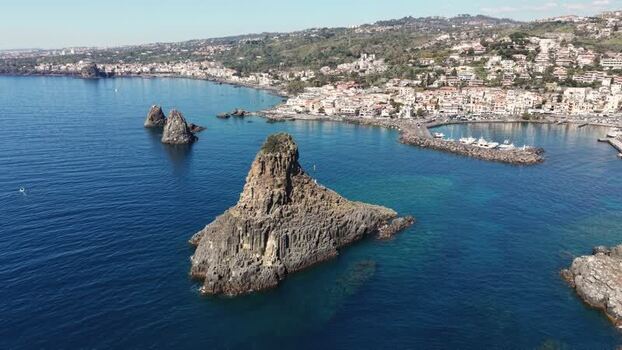 Aerial view of Islands of the Cyclops and Aci Castello Italy.