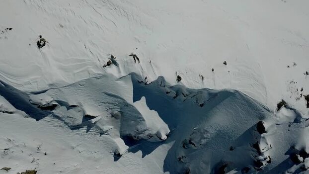Aerial view of snow covered mountain slopes in Baqueira Spain.