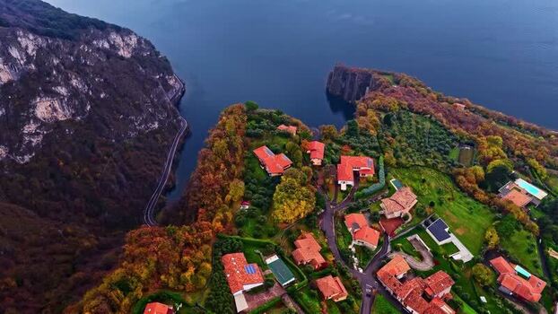 Aerial view of coastal villas and cliffs in Italy.