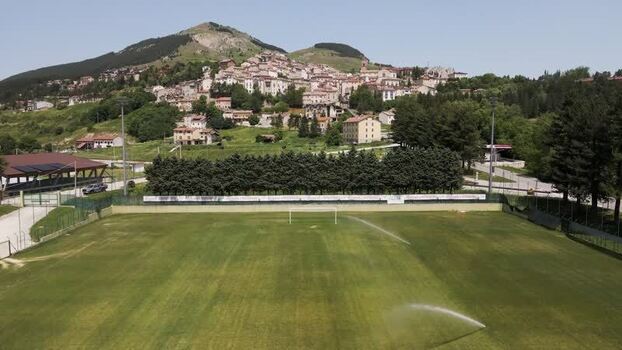 Aerial view of a football field and Rivisondoli town Italy. Aerial view of a football field and Rivisondoli town Italy.