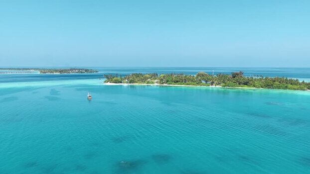 Aerial view of a tropical island with turquoise water Maldives. Aerial view of a tropical island with turquoise water Maldives.