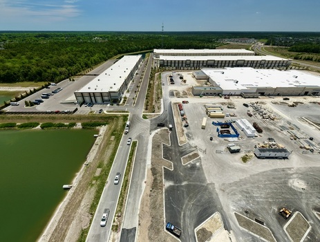 Aerial view of the industrial development at Saint Johns Parkway and International Golf Parkway with warehouses and a retention pond World Golf Village Florida United States. Aerial view of the industrial development at Saint Johns Parkway and International Golf Parkway with warehouses and a retention pond World Golf Village Florida United States.