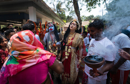 Munshiganj Bangladesh 13 April 2025 View of a vibrant religious procession with costumed figures and painted faces amidst billows of fragrant smoke. Munshiganj Bangladesh 13 April 2025 View of a vibrant religious procession with costumed figures and painted faces amidst billows of fragrant smoke.